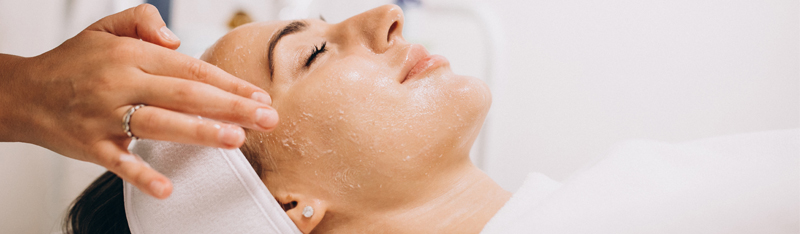 A woman enjoys a rejuvenating facial at DSL Clinic, enhancing skin glow and confidence.