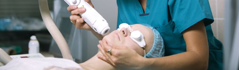 A young woman, once battling razor burns, now smiles confidently after laser treatment at a top laser and skin clinic.